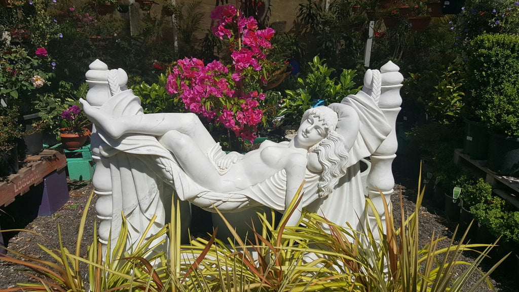 Marble Lady statues on swing